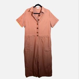 Roolee. Mauve pink short sleeve jumpsuit with pockets. Has both buttons and zip.